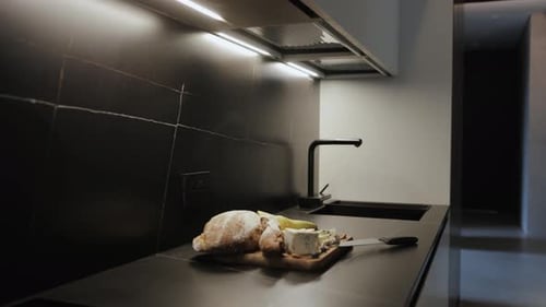 Stylish Bread, Cheese, and Fruit in Modern Kitchen