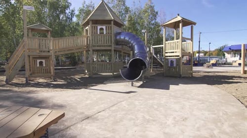 Playground with Multicoloured Equipment Awaits Children