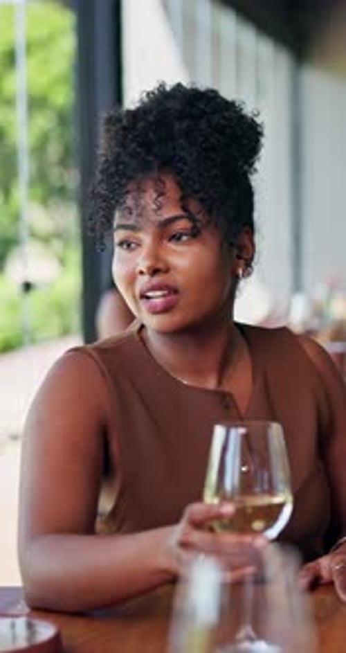 Talking, wine and women with friends in restaurant for hangout, social gathering and reunion