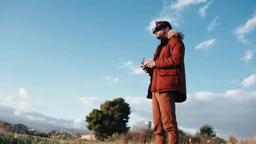 Man Landing His Fpv Drone with Virtual Reality Goggles on the Head