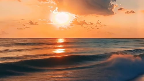 Stunning sunset over the ocean. Golden sun sets over rippling waves