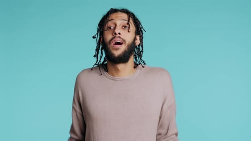 Uncaring Man Shrugging Shoulders Showing Indifference Studio Background