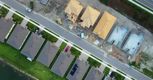 Aerial View of Unfinished Wooden Frames of New Houses Under Construction Development of Residential