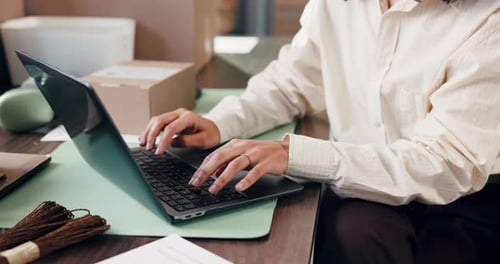 Supply chain, typing and hands of woman on laptop in office for online orders