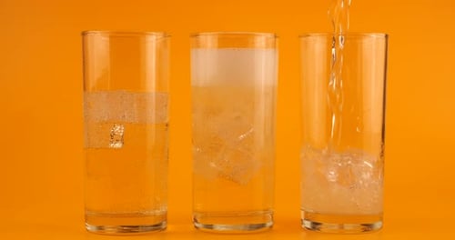 Soda, Water, and Milk Being Poured into Glasses