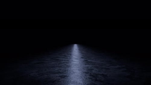 Light beam moving on dark concrete floor