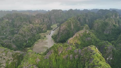 Aerial View of Tam Coc Valley with Limestone Mountains and River in Ninh Binh