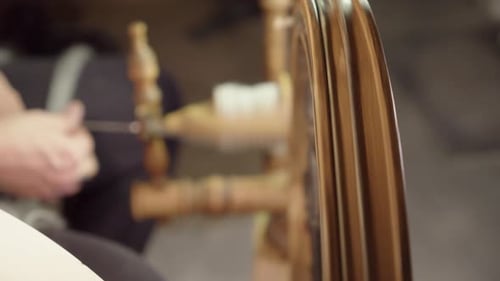Narrow focus: Traditional Nordic spinning wheel spins yarn from wool