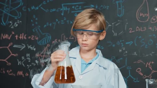 Blond Boy with Safety Goggles Holding a Flask