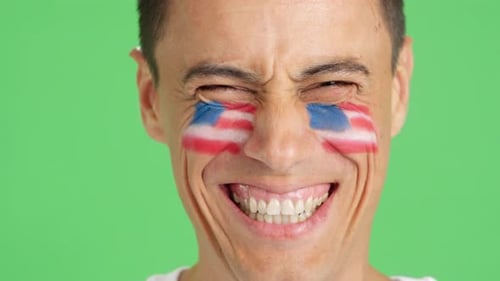 Man With Painted US Flags Smiles Close Up