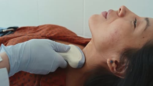 Hispanic Woman Getting Thyroid Sonography