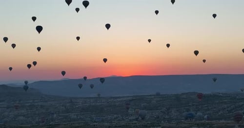 Aerial Cinematic Drone View of Colorful Hot Air Balloon Flying Over Cappadocia