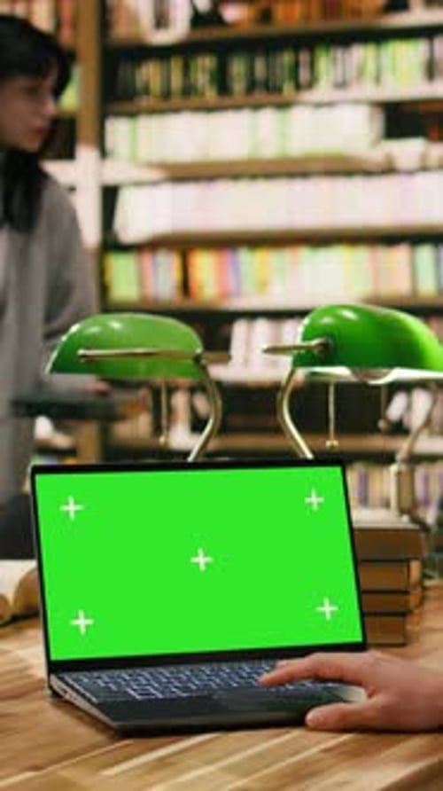 Vertical Video Green Screen Mockup on Laptop in Library Study Environment