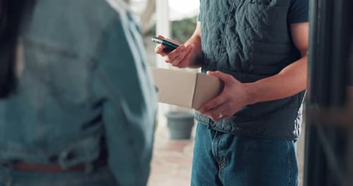 Package Delivery Man Using Phone with Customer