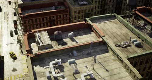 Urban Rooftop View Showcasing Industrial Structures and City Life