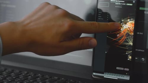 Hand Interacting with Cybersecurity Threat Analysis Graphic