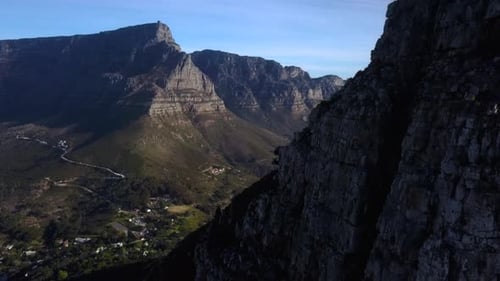 Ascending over Lions Head Mountain Peak, revealing Table Mountain in the background, Cape Town South