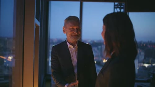 Successful Colleagues Looking City View Shaking Hands at Dark Workspace Closeup