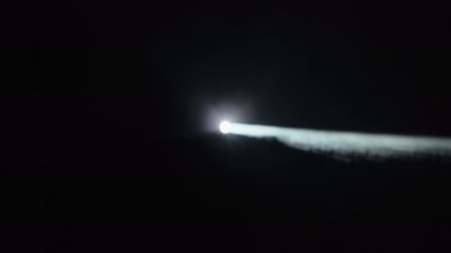 Abstract Light Beam Reveals Obscured Writing on Black