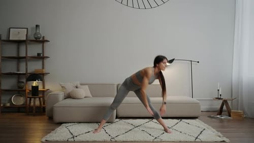 Woman Stretching in a Modern Living Room