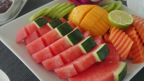 Vibrant Fruit Assortment Bright Tropical Fruit Display Colorful Mix of Cut Tropical Fruits with