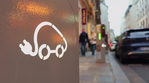 Electric Car Charging Station on City Sidewalk