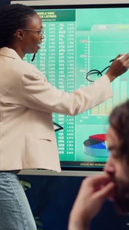 Financial Analysts Team Evaluating Market Trends and Infographics