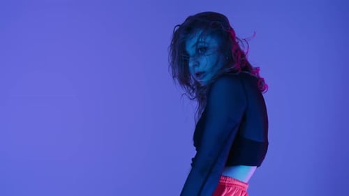 Seductive Woman Dancing Twerkcolorful Neon lightDancer Moving to Music Rhythm