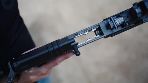 Loading Bullets into a Rifle, Close Up