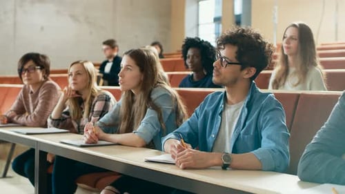 University Students Attending Lecture in a Classroom