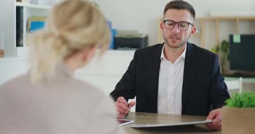 Real Estate Agent During Negotiations in Business Meeting