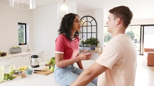 Couple Chatting in Bright Modern Kitchen