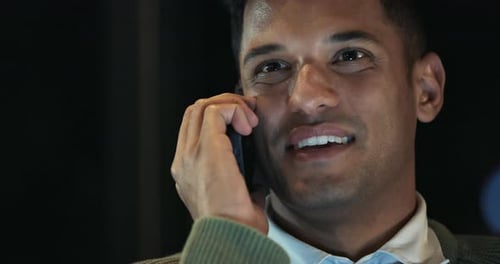 Man Talking on Cell Phone at Night