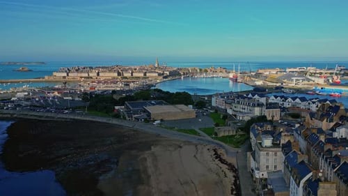 Aerial View of Coastal Town Next to Beach