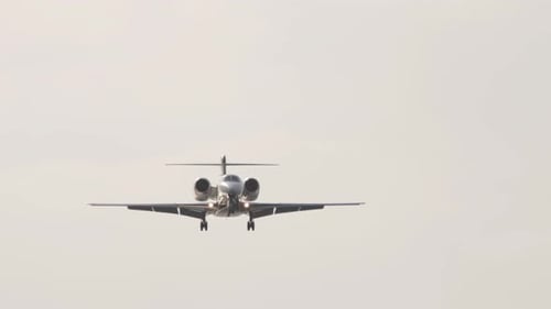 Private Jet in the Backlit Sky