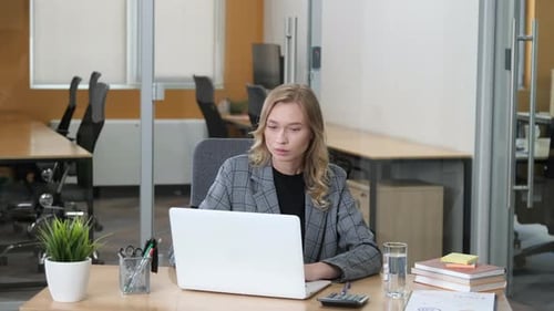 Working Businesswoman at Her Office