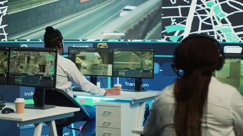 People Work in High-Tech Control Room