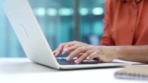 Close up of african american female hands typing on laptop keyboard in office. Businesswoman works