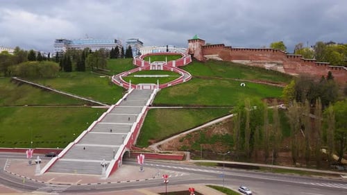 Grand Staircase Ascends Lush Hillside in Urban Landscape