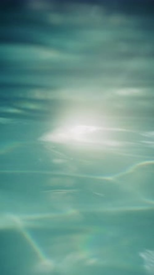 Sunlight Shimmers Underneath Clear Blue Ocean Water