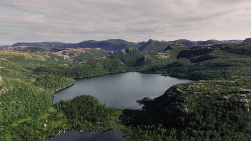 Aerial Shot Flying Over a Beautiful Lake in a Norwegian Landscape