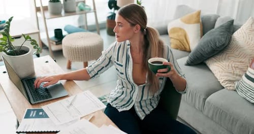 Woman Working From Home With Laptop and Coffee
