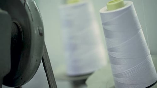 Closeup Of Cotton Thread Spools On A Sewing Fashion Industry Manufacturing
