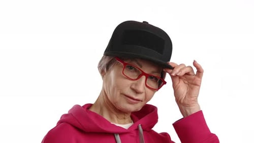 Trendy Elderly Woman Tipping Black Cap and Glasses