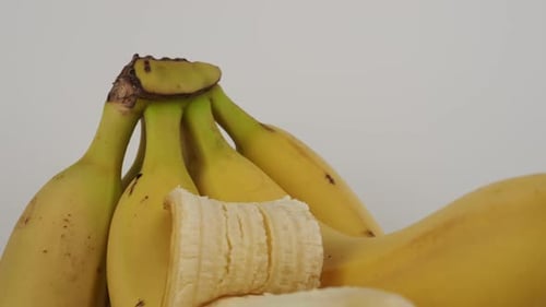 Bunch of Yellow Bananas, Partially Peeled
