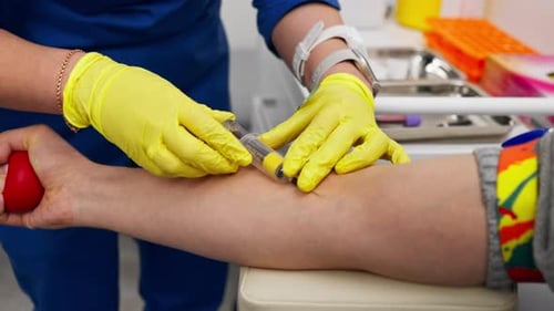 Close Up in the Clinic a Guy Asks a Doctor with a Blue Form for Blood Tests Healthy Lifestyle
