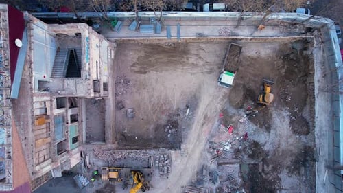 Workers Dismantling The Building