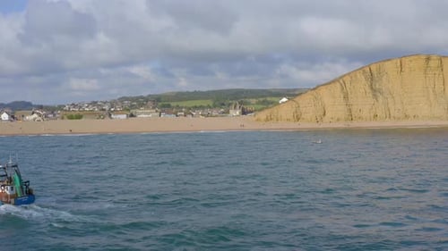 Commercial Fishing Vessel Heading out to Sea in the UK
