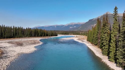 Canada. A drone view of the river in the mountains valley. An aerial view of river. Winding river.