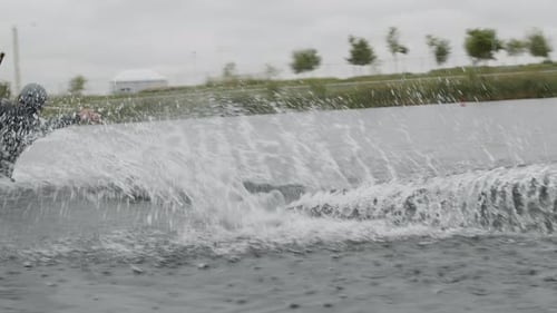 Wakeboarder Riding across Lake